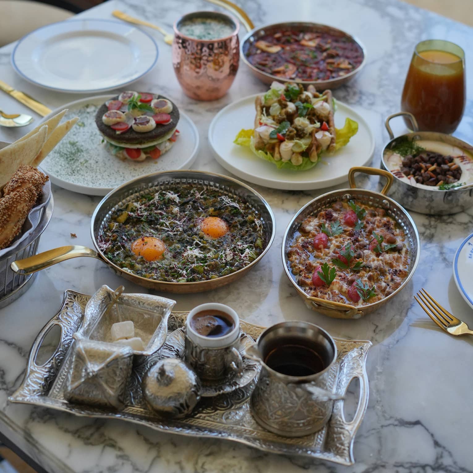 Traditional Jordinian breakfast spread set on a white marble table