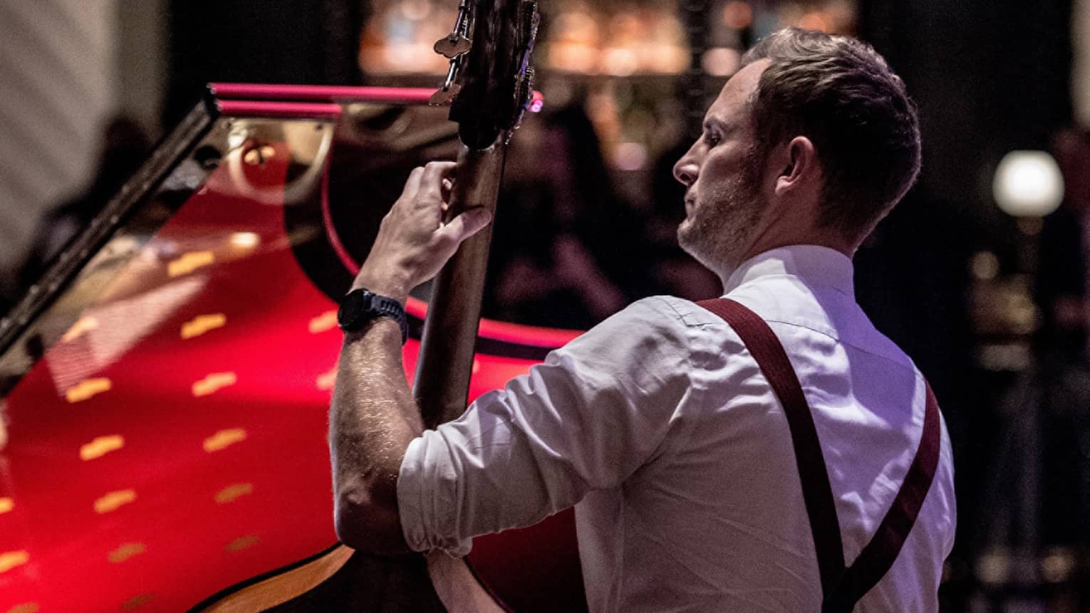 Bond Street Band, back of musician wearing suspenders and holding upright bass 