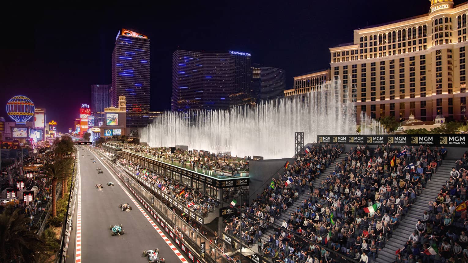 A race track with seats lining the track and people watching.