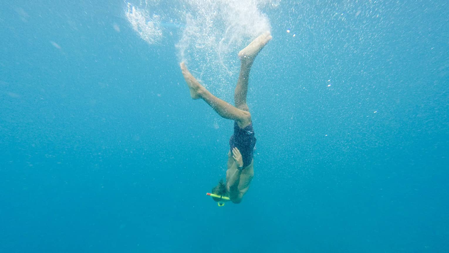 Woman diving underwater in ocean