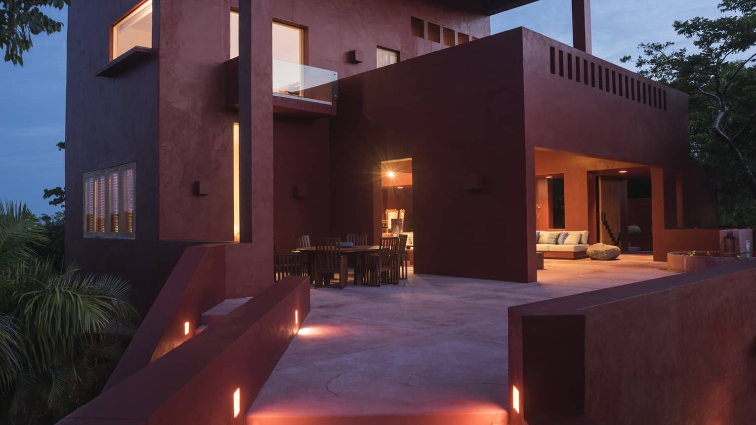 Walkway to terrace of private villa at night
