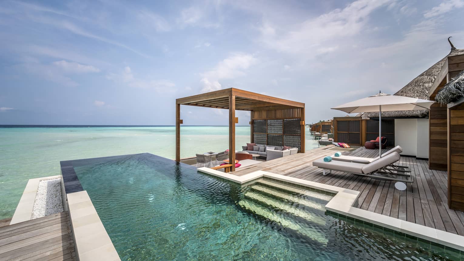 The infinity and sea view from the two-bedroom water suite