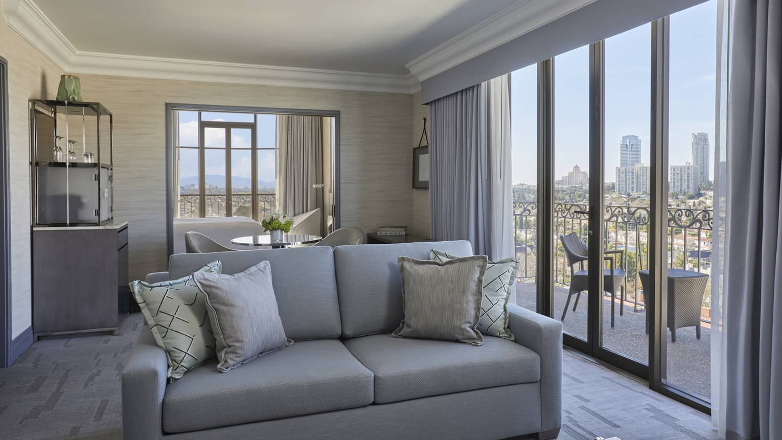 Hotel living room with city-view balcony