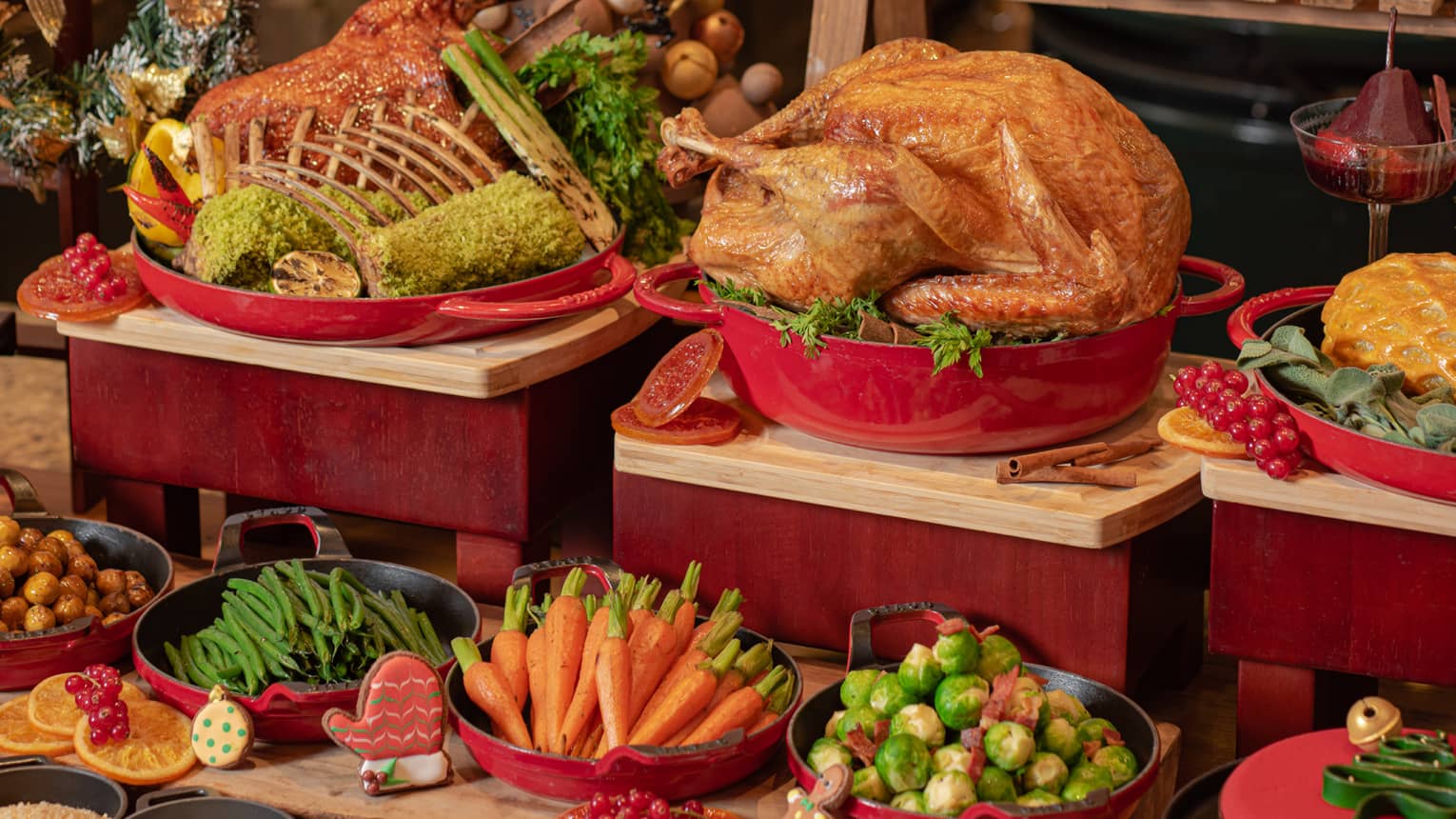 Holiday buffet featuring whole roasted turkey, carrots. Brussles sprouts, green beans, prime rib