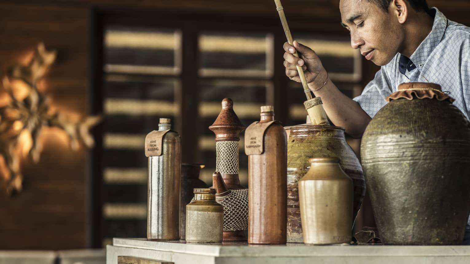 A collection of various jars filled with infused arak 