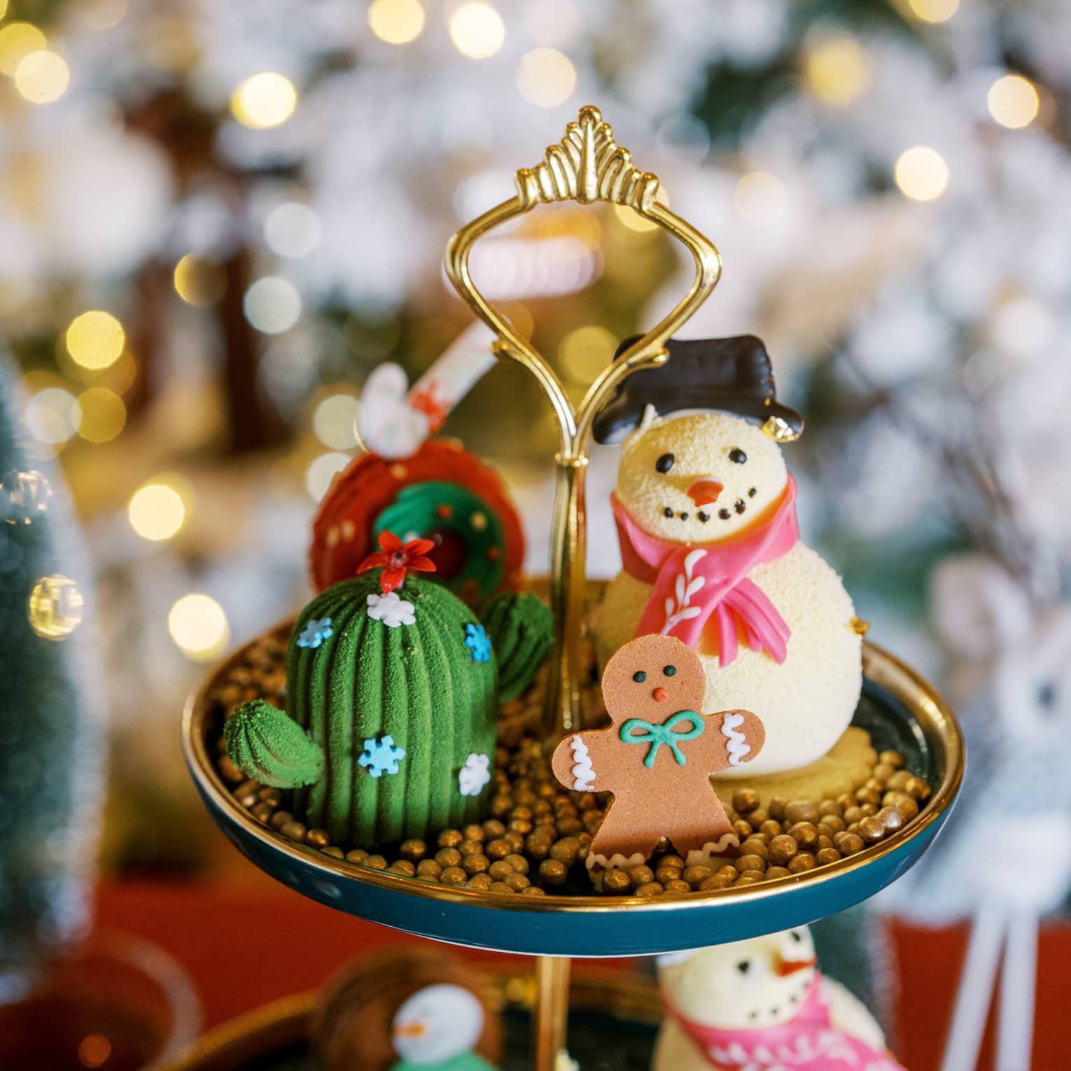 A display with a snowman and gingerbread man and lights in the background