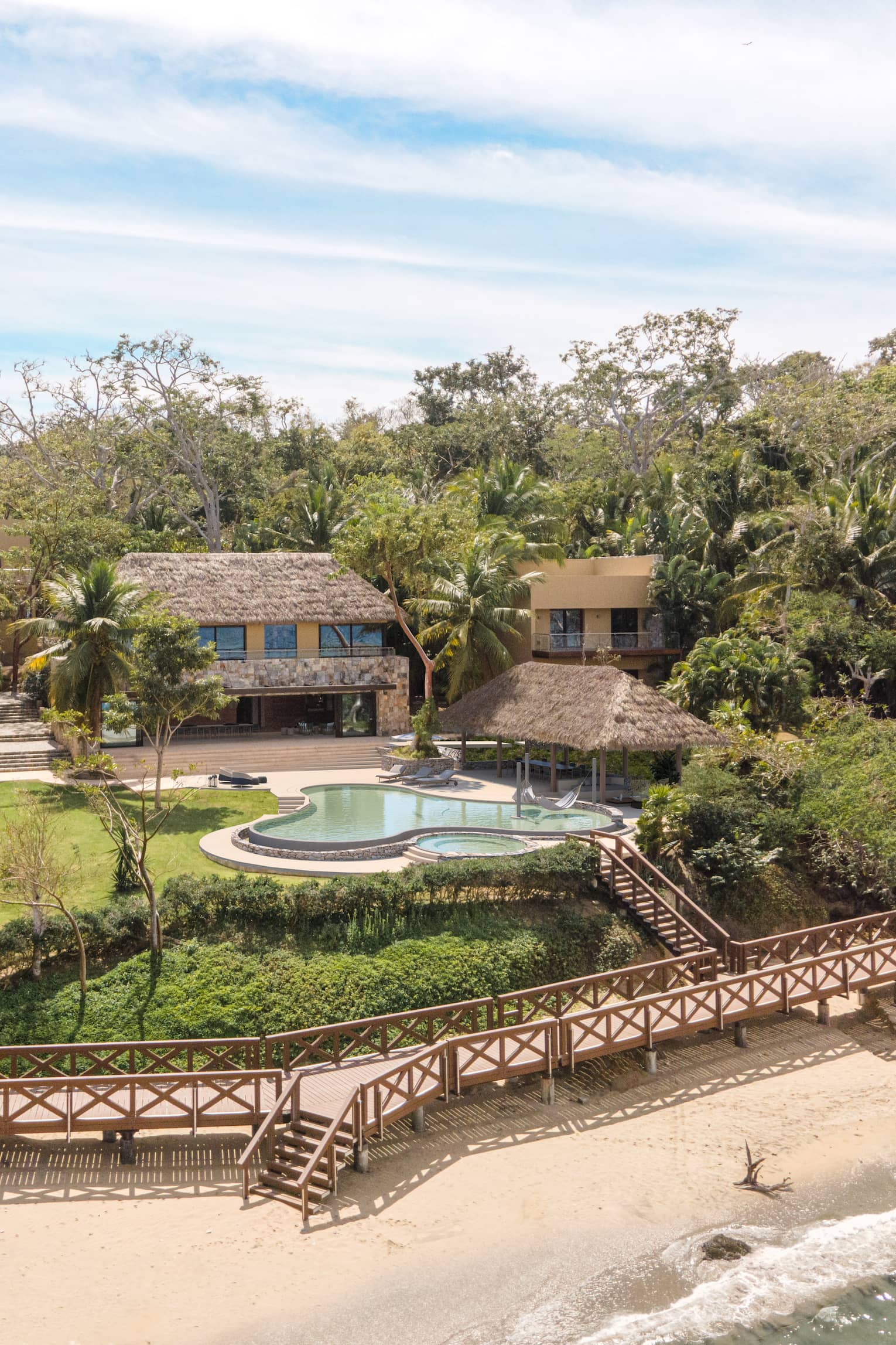 Aerial view of residence, pool and boardwalk