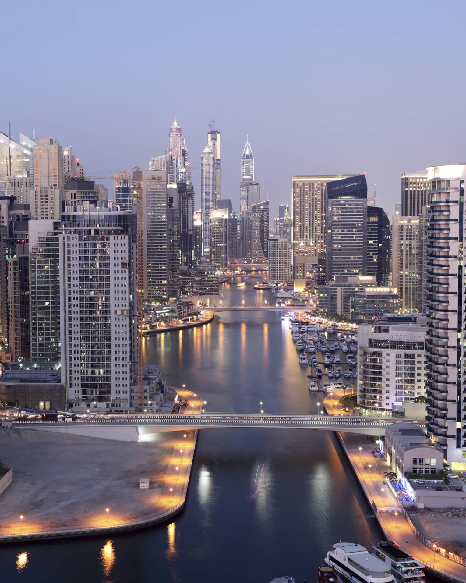 Dubai skyline buildings and marina at dusk