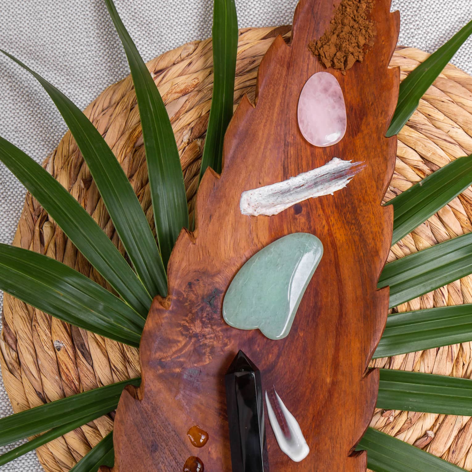 AgaveSpa arrowhead-shaped wooden tray with gemstones and treatment oils
