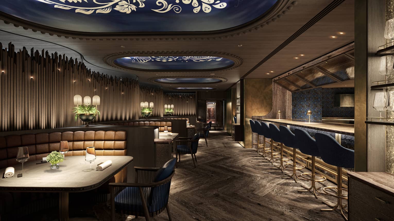 Elegant restaurant interior with dim lighting, tufted leather booth seating, modern decor and a bar lined with blue upholstered stools.