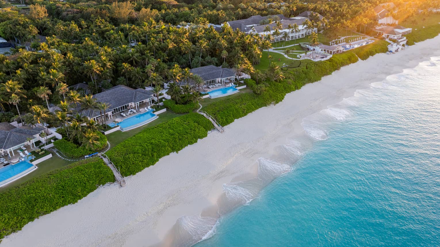 Aerial view of ocean, sand and oceanfront homes