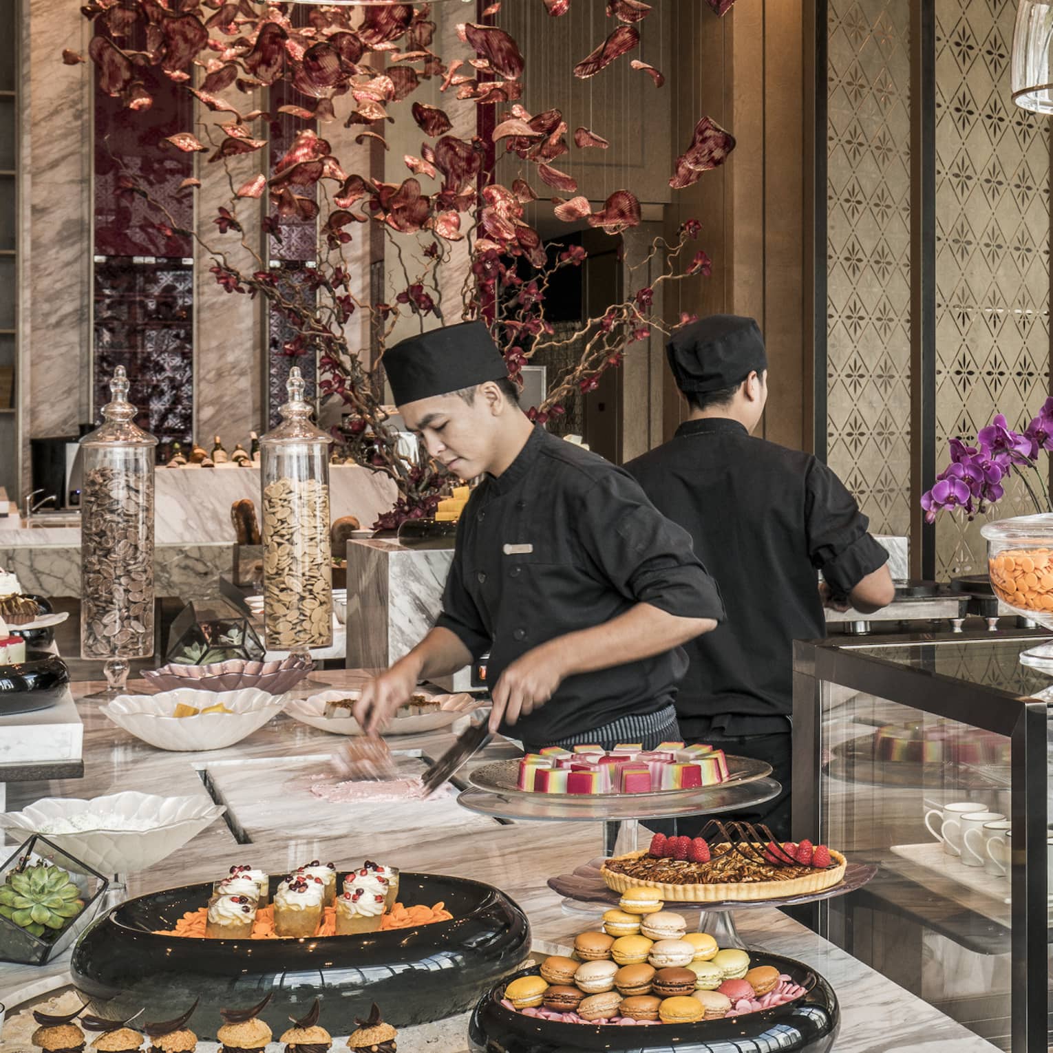 Curate dessert station with two chefs making treats