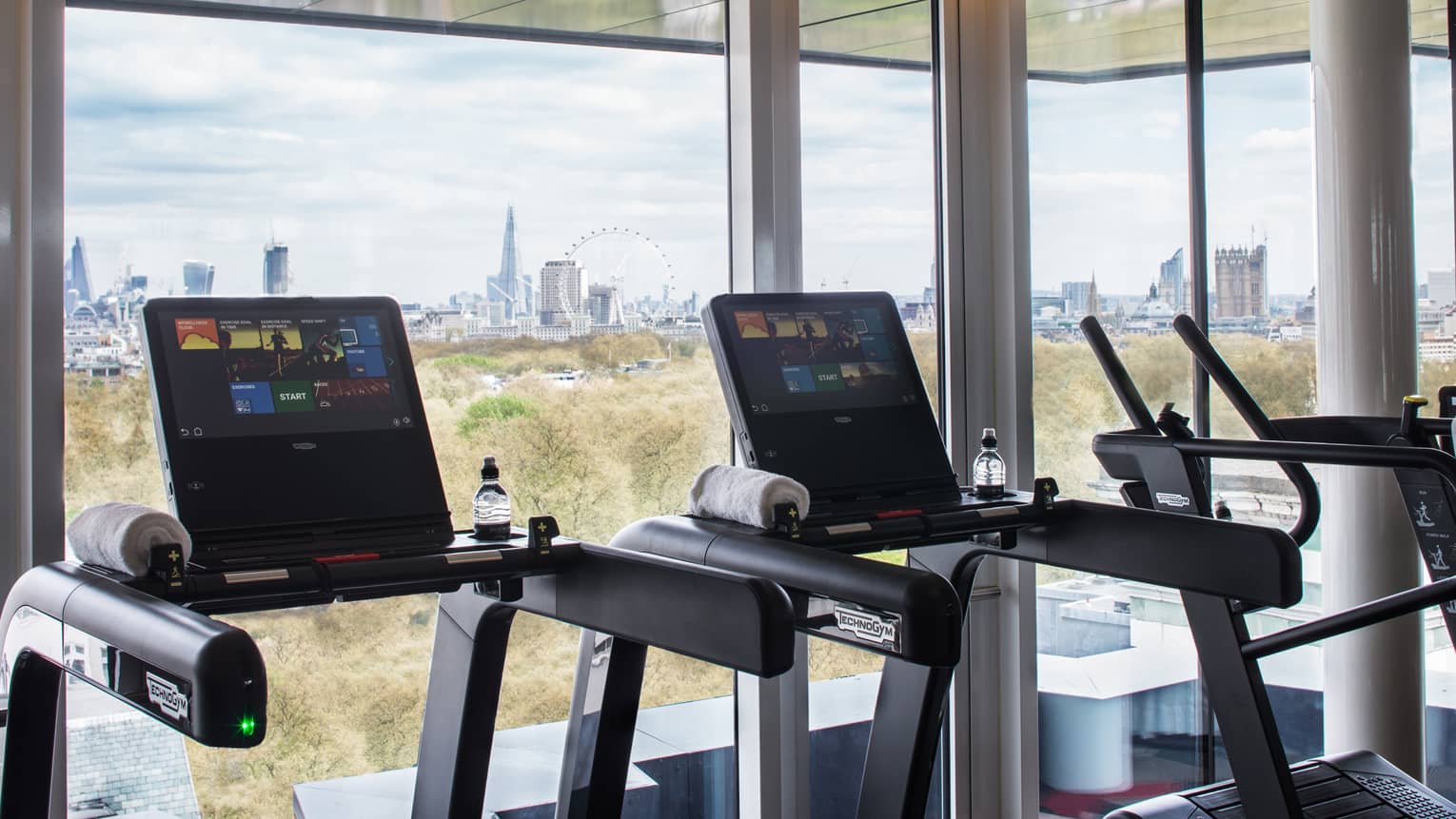 Treadmills along sunny window it Fitness Centre 