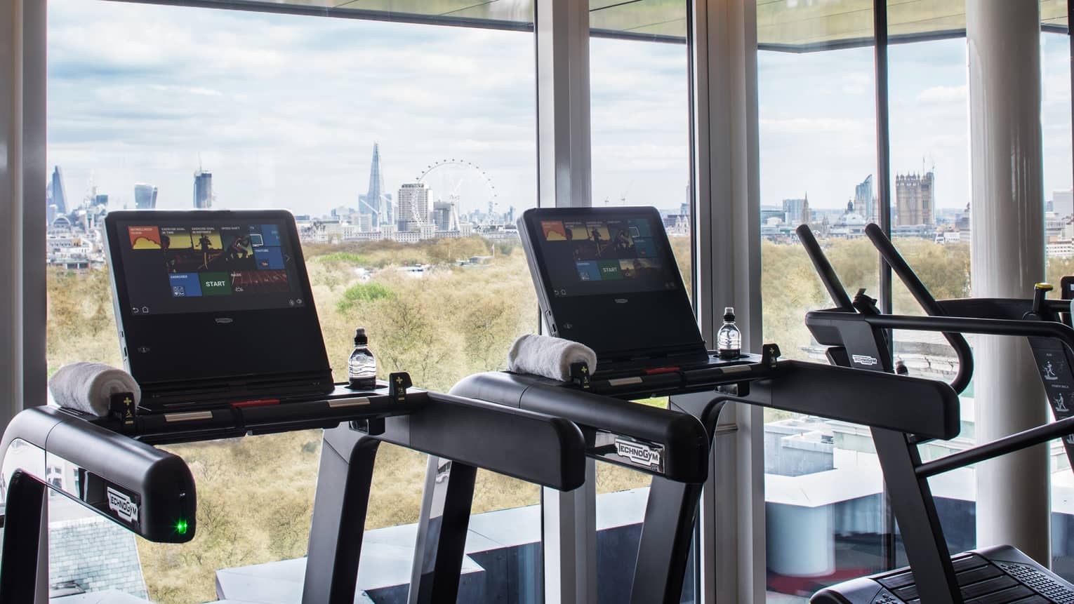 Treadmills along sunny window it Fitness Centre 