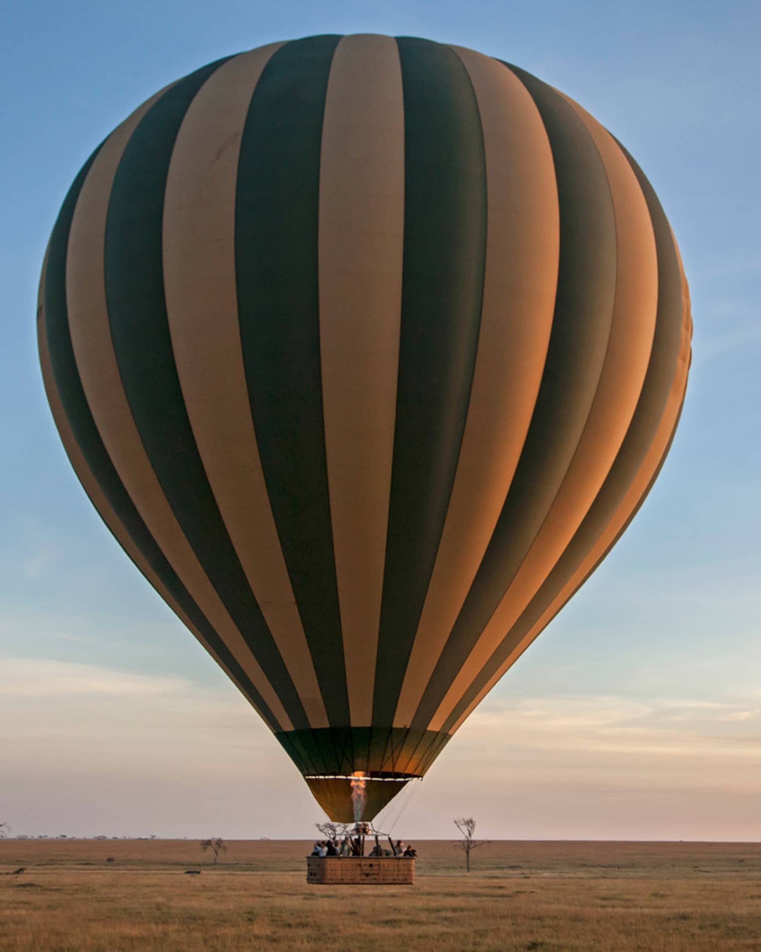A hot air balloon ride at sunset