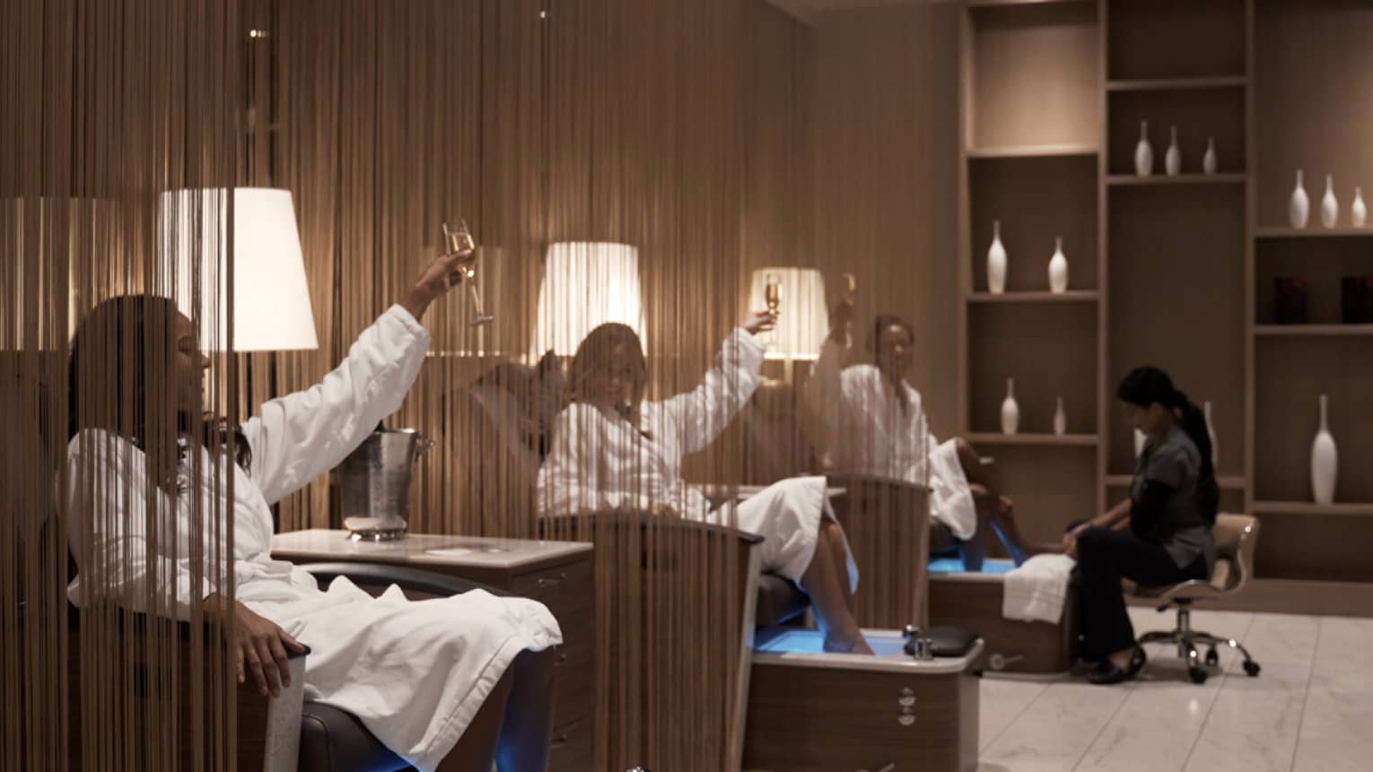 A group of women in a spa toasting with wine.