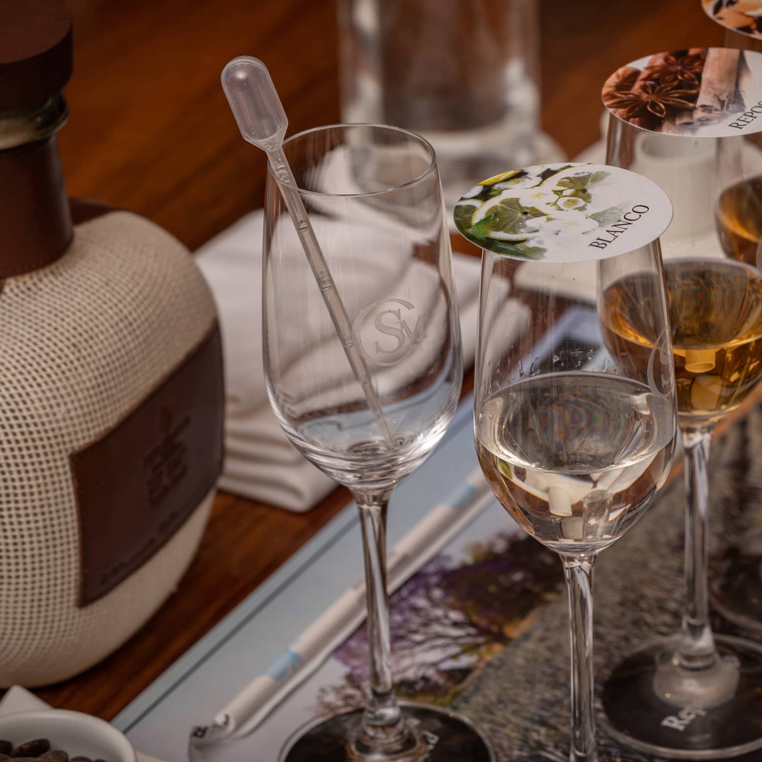 Blending tequila in glasses with covers.