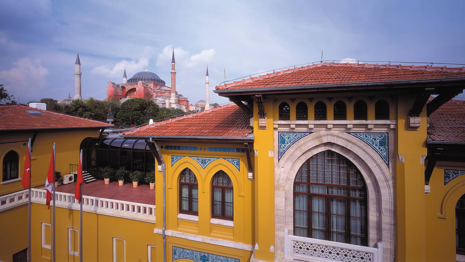 View past yellow neoclassical style Four Seasons Hotel Istanbul at Sulthanamet building