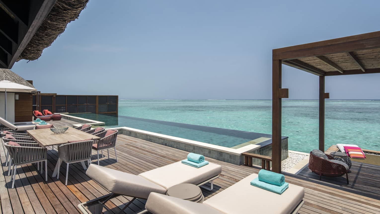 A view of the ocean and plunge pool of sunrise three-bedroom water suite