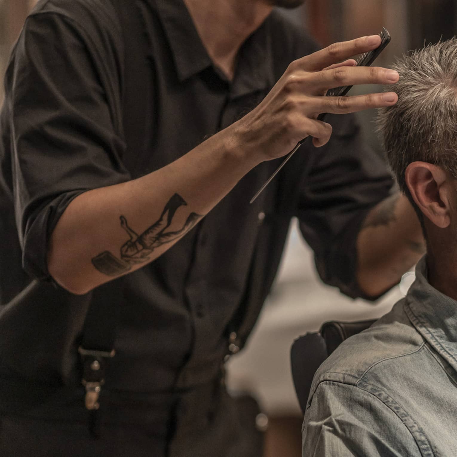 Man receives haircut in the Spa's barbershop