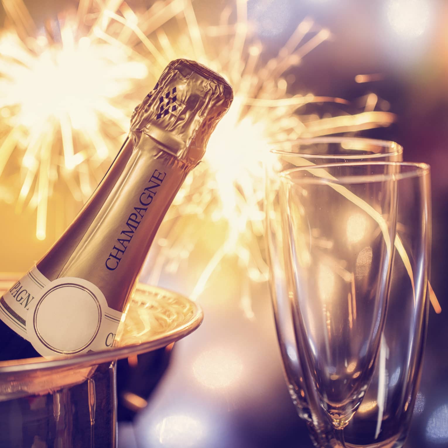 Fireworks, champagne and two champagne flutes