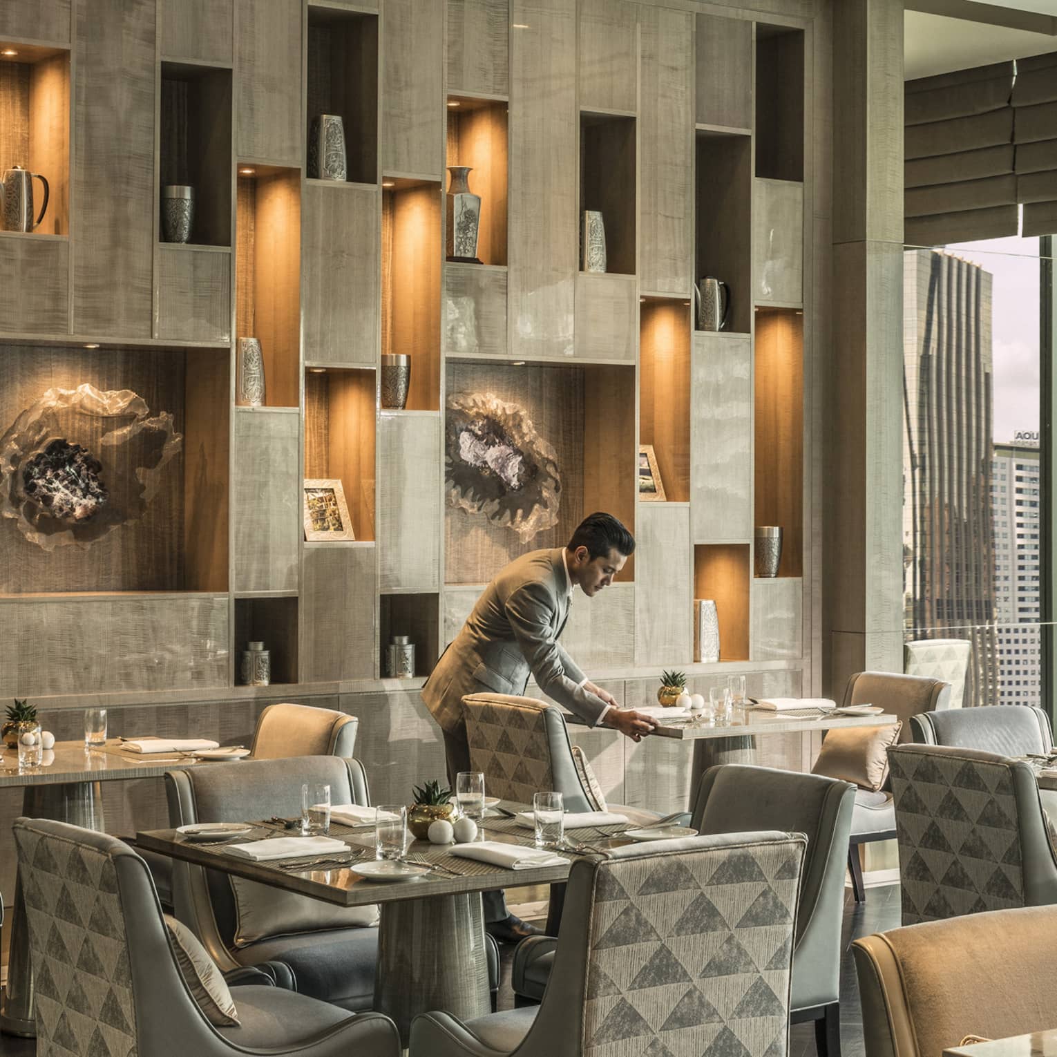 The Executive Club at Four Seasons Hotel Kuala Lumpur offers sleek seats and views of KLCC Park