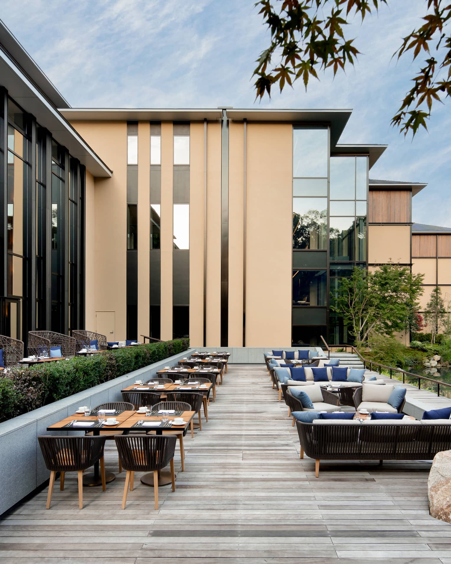 Tables, chairs and large rock on Brasserie Terrace