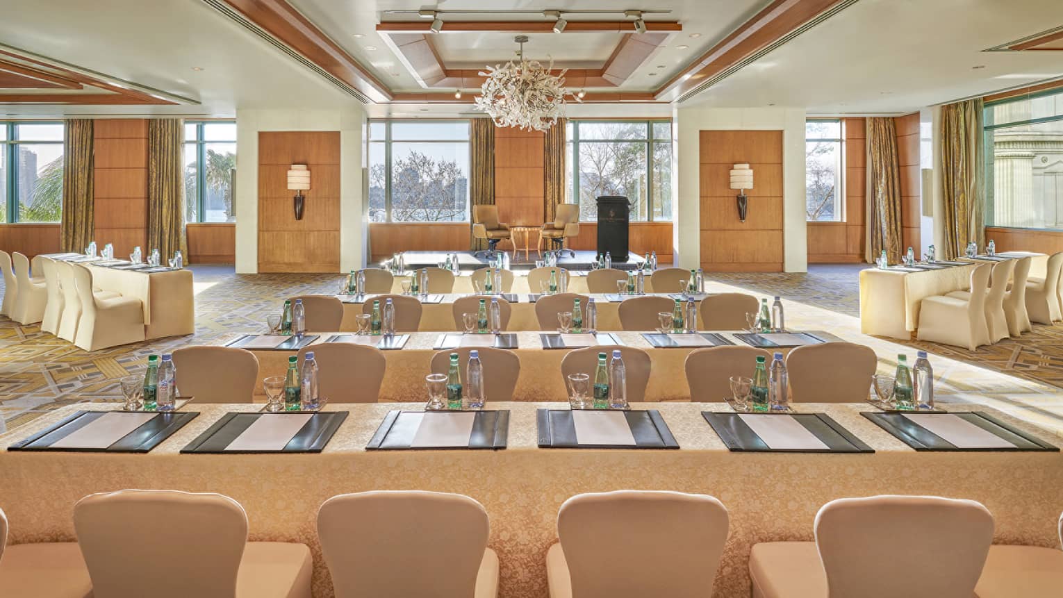 Bright Nile Ballroom with rows of conference meeting tables and chairs