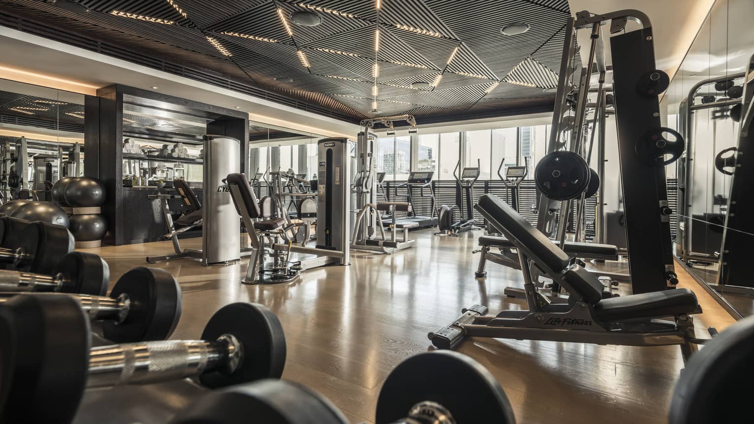 Cardio machines and weight stations line the Fitness Centre