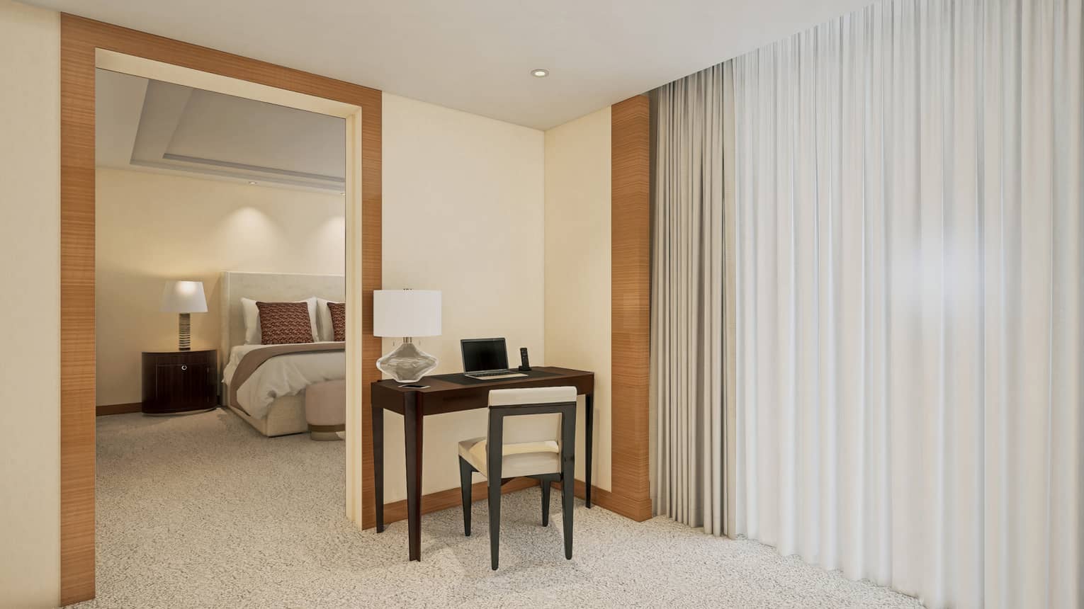 Desk and chair sits outside a bedroom