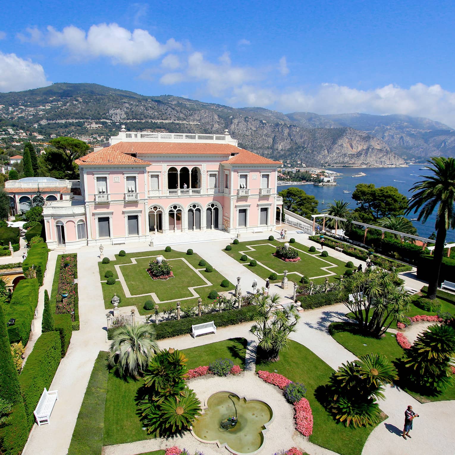 The Grand Hotel, overlooking the water with beautiful arches and pristine gardens
