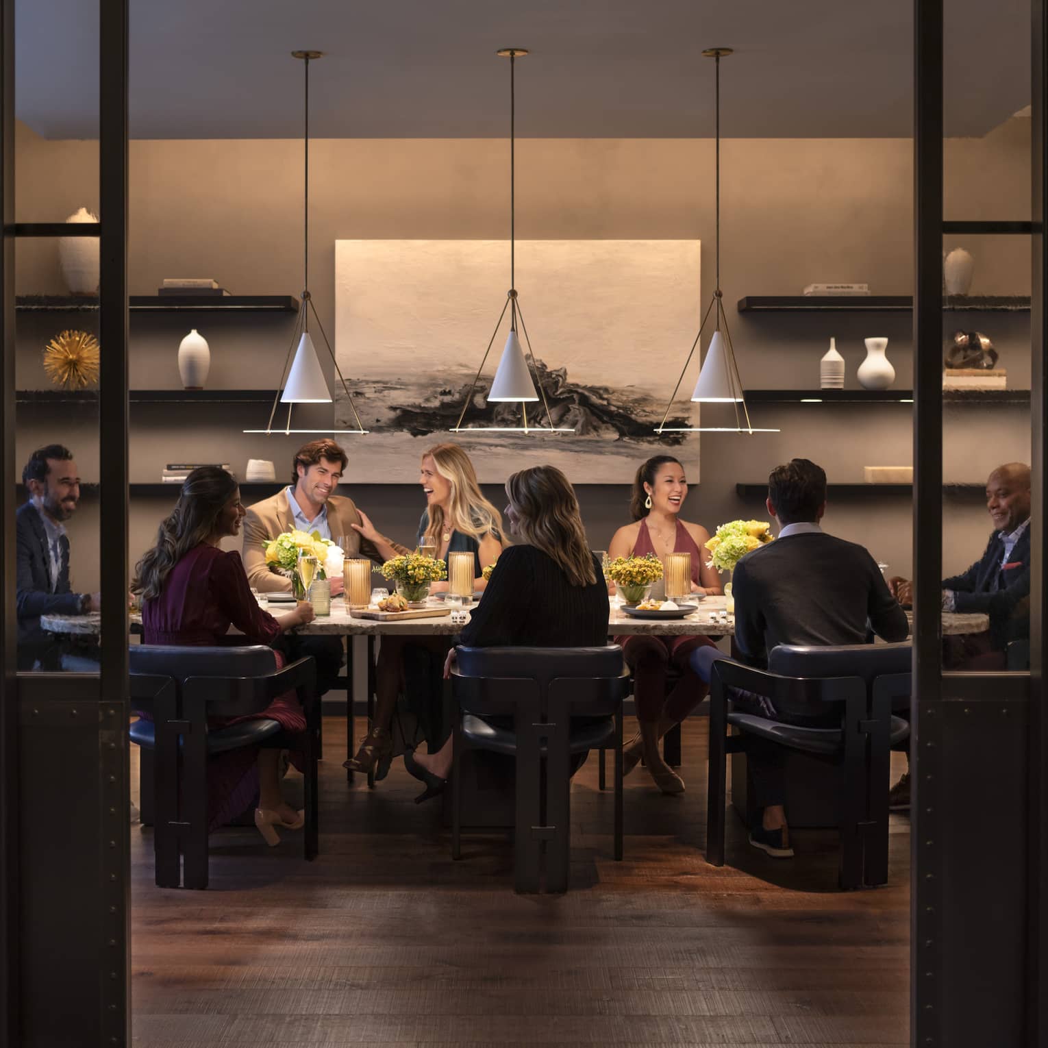 Interior of restaurant with group eating at table
