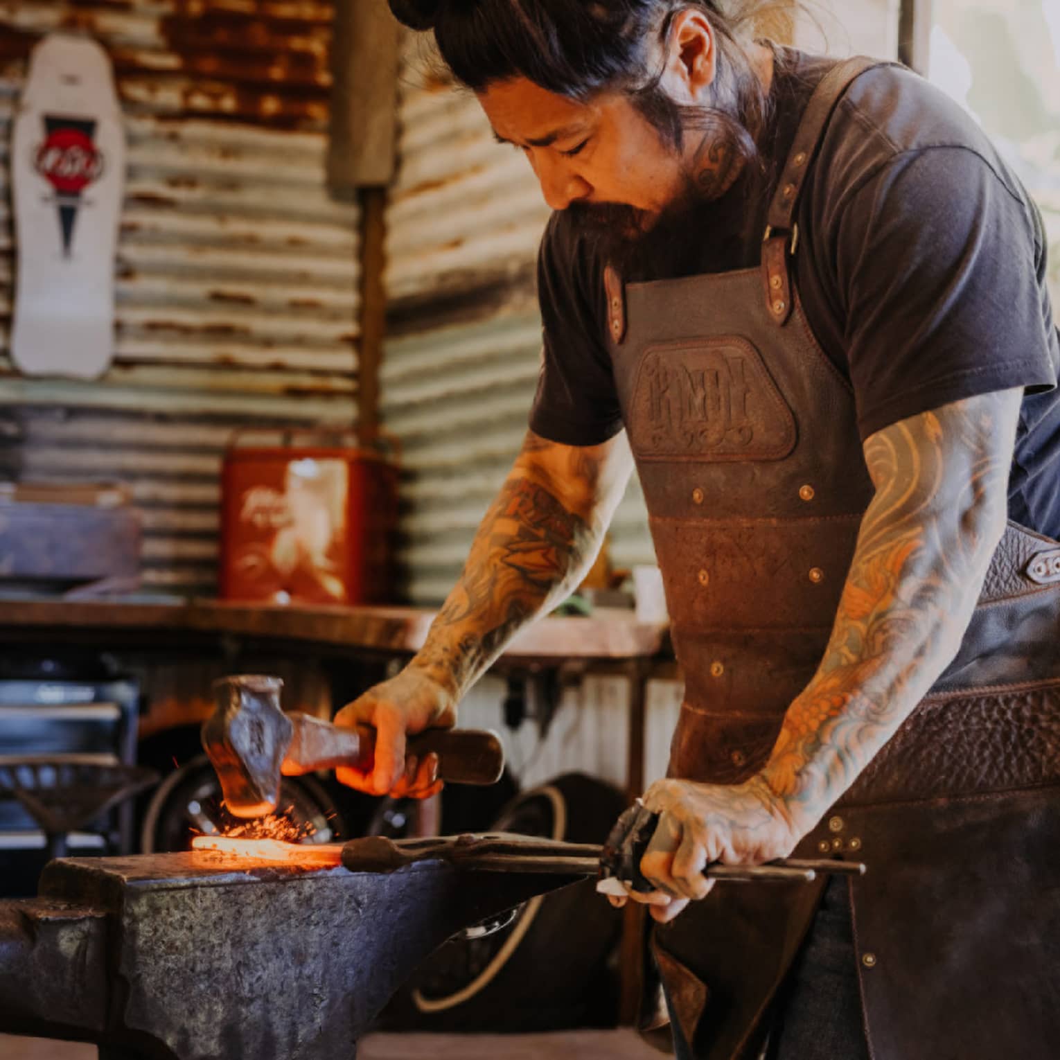 A blacksmith forges a knife in his Hawaii Island shop