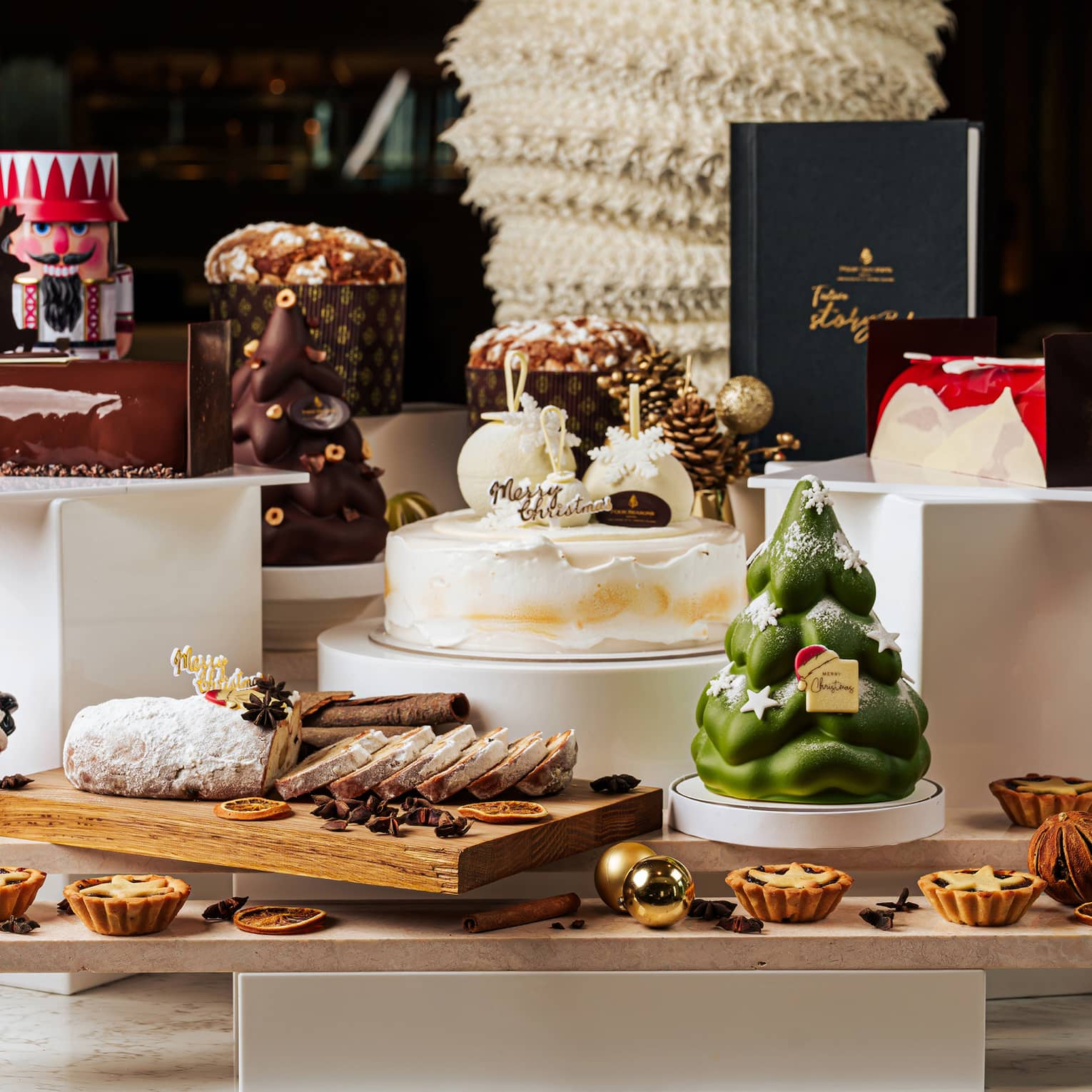 Table display of various Christmas desserts and decorations