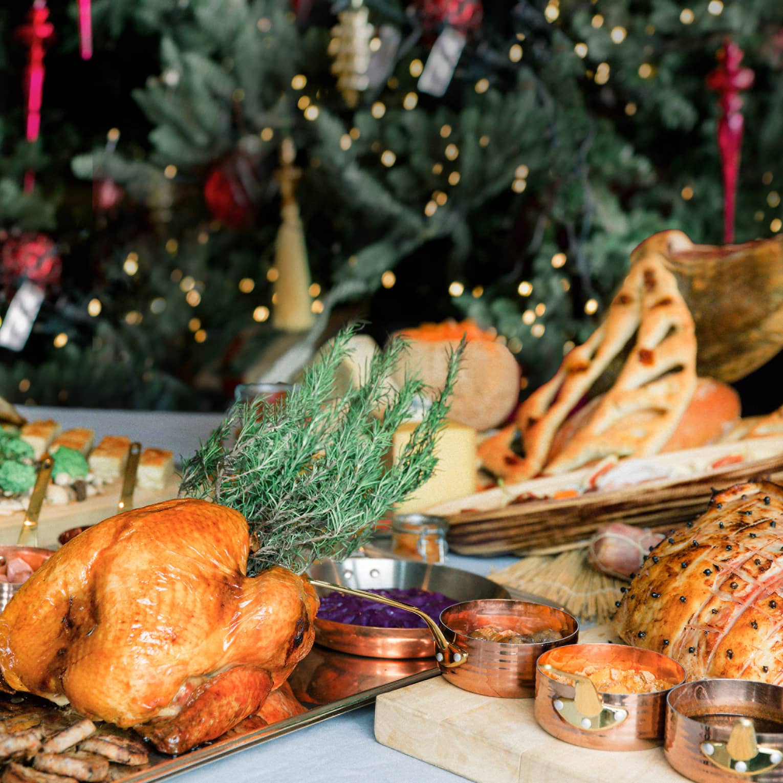 Thanksgiving takeaway dinner with a Christmas tree in the background