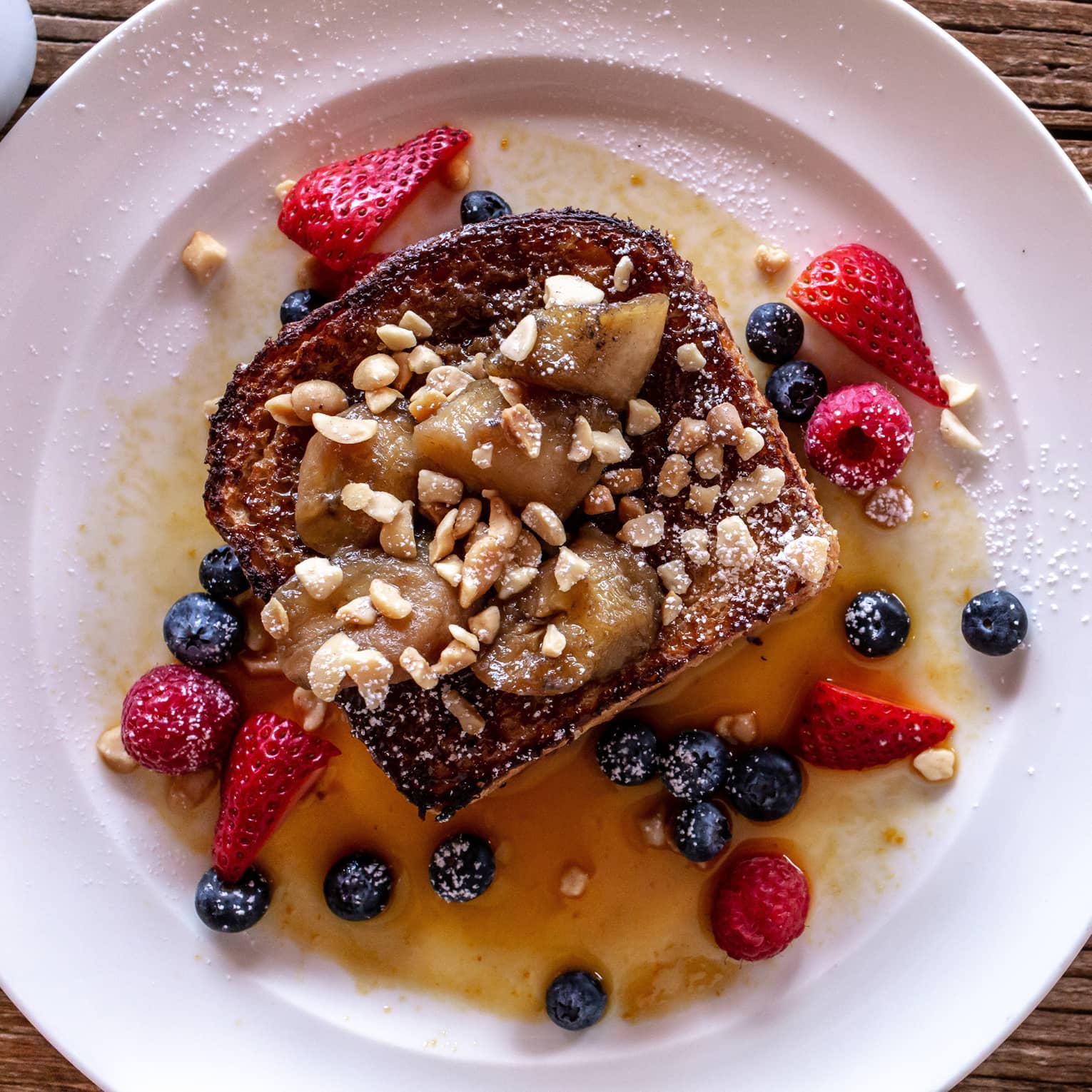 Coconut brown sugar french toast with strawberries and blueberries