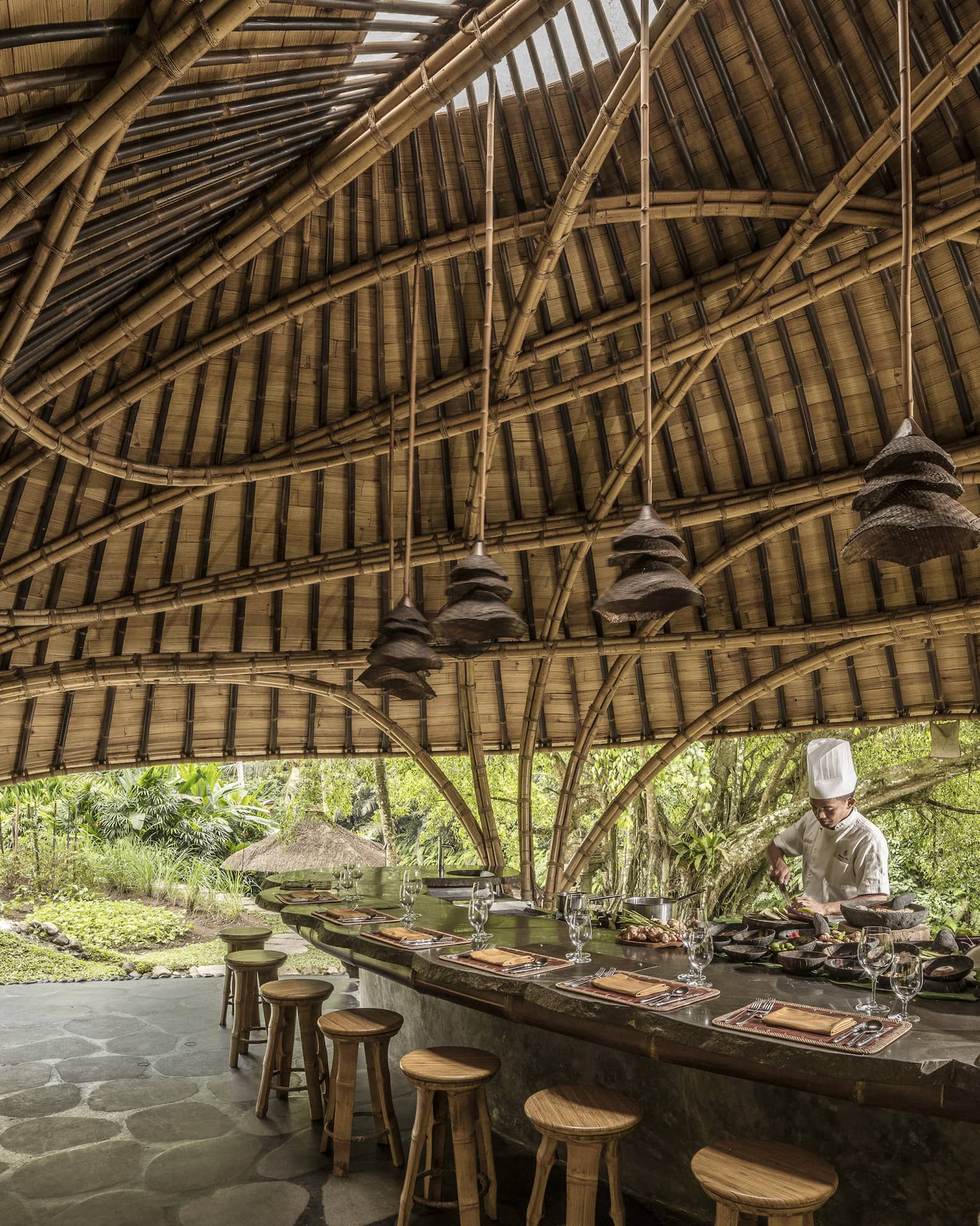 A chef prepares for Sokasi Cooking School in a bamboo pavillion