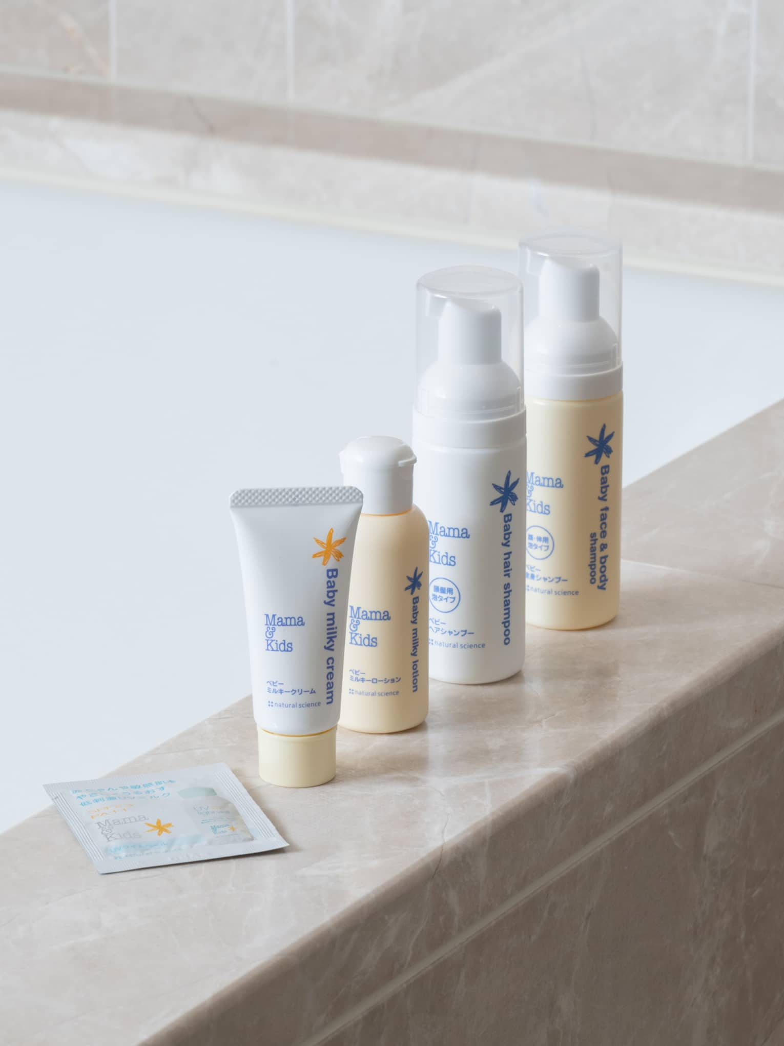 Bath amenities on edge of marble tub