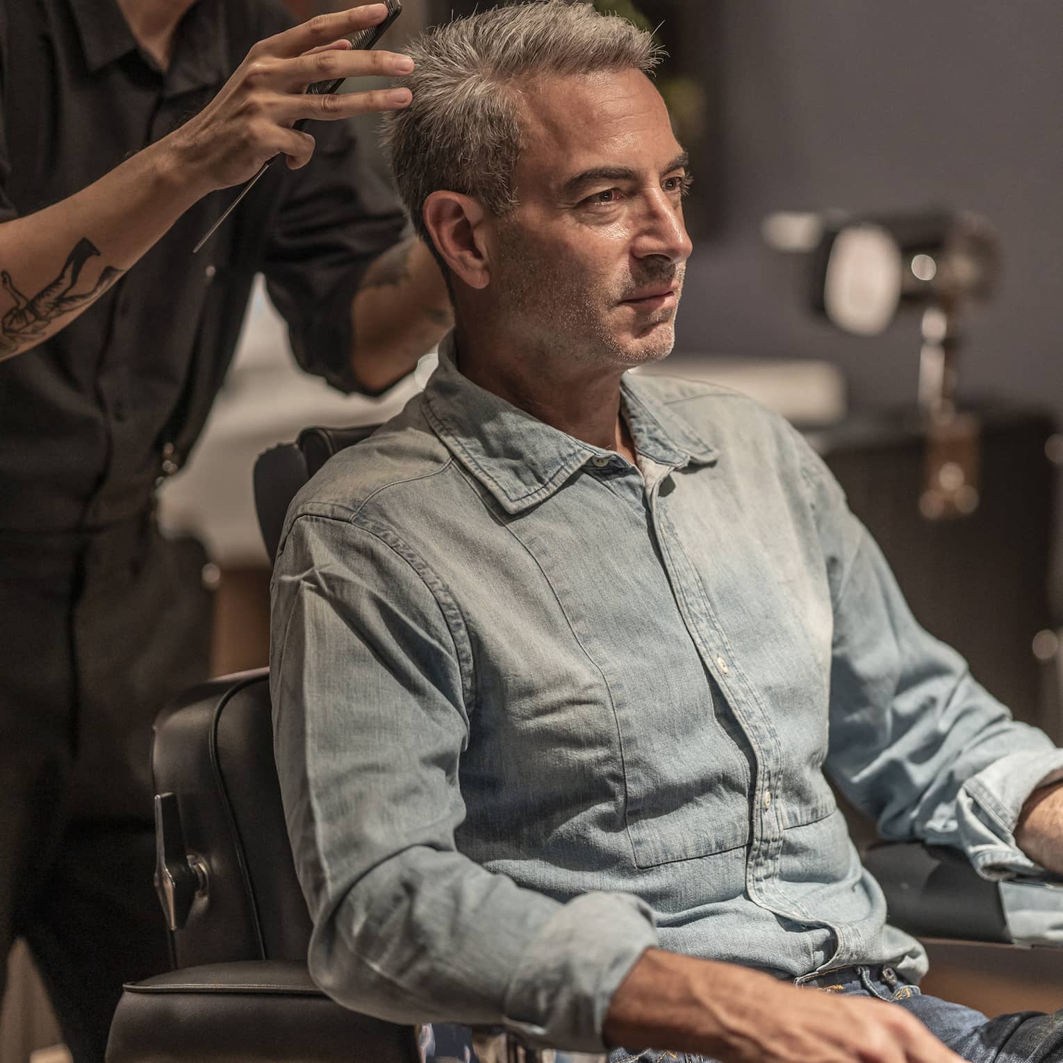 Man receives haircut in the Spa's barbershop