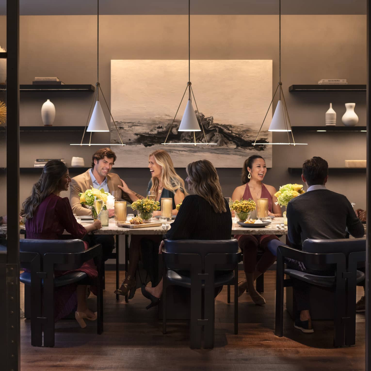 Interior of restaurant with group eating at table