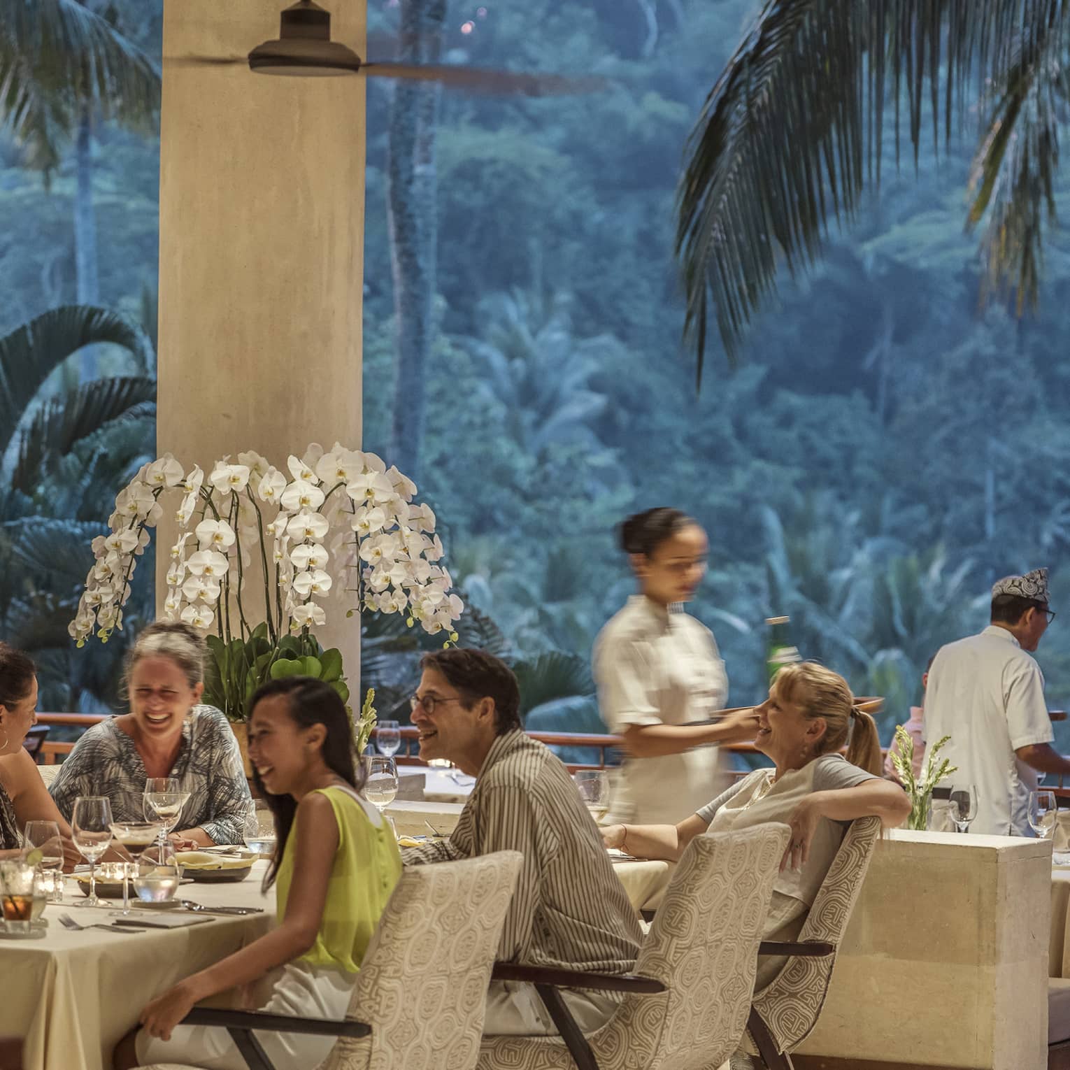 Ayung Terrace open air restaurant dining room surrounded by large palms