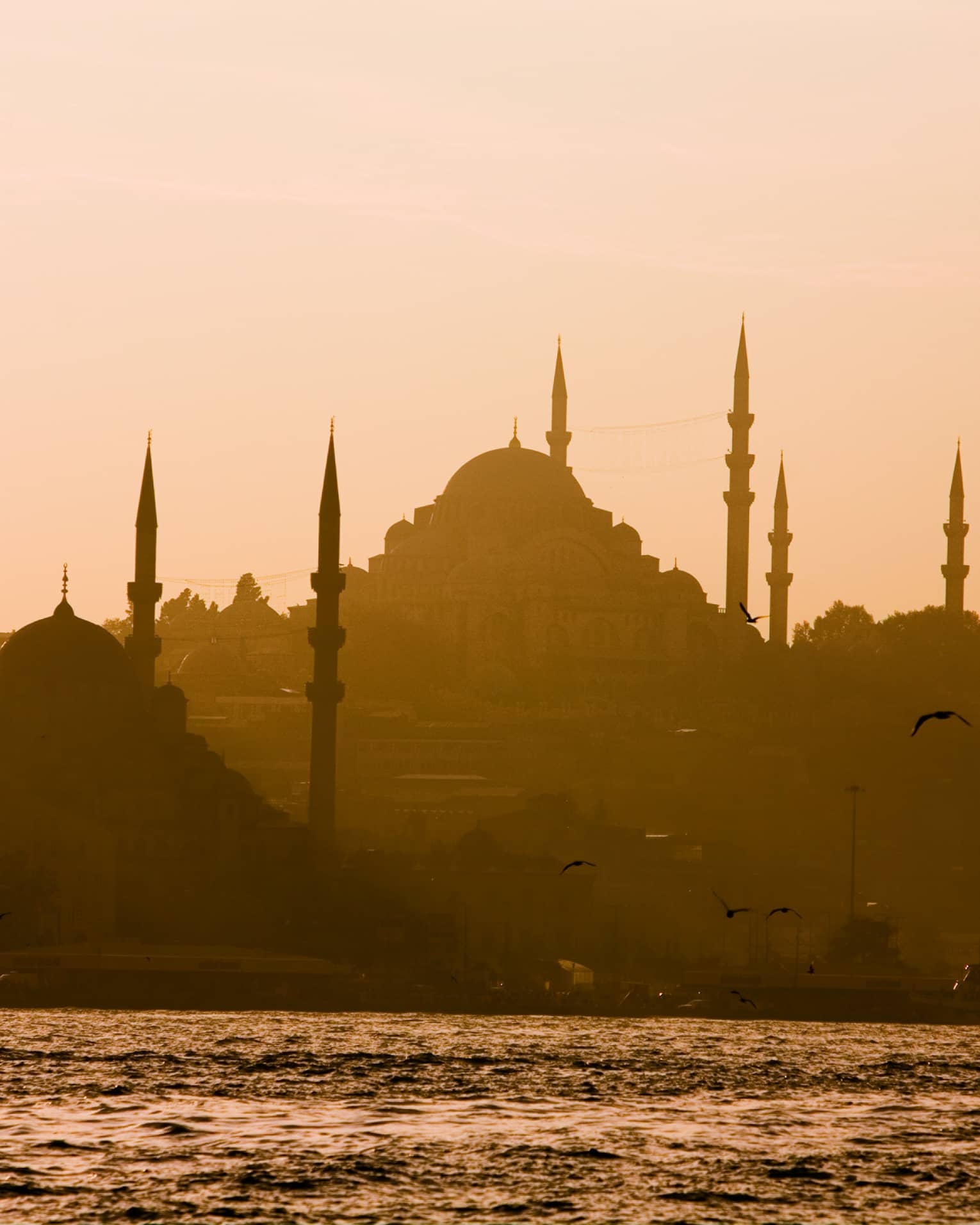 Silhouette of domed Blue Mosque in Istanbul at sunset