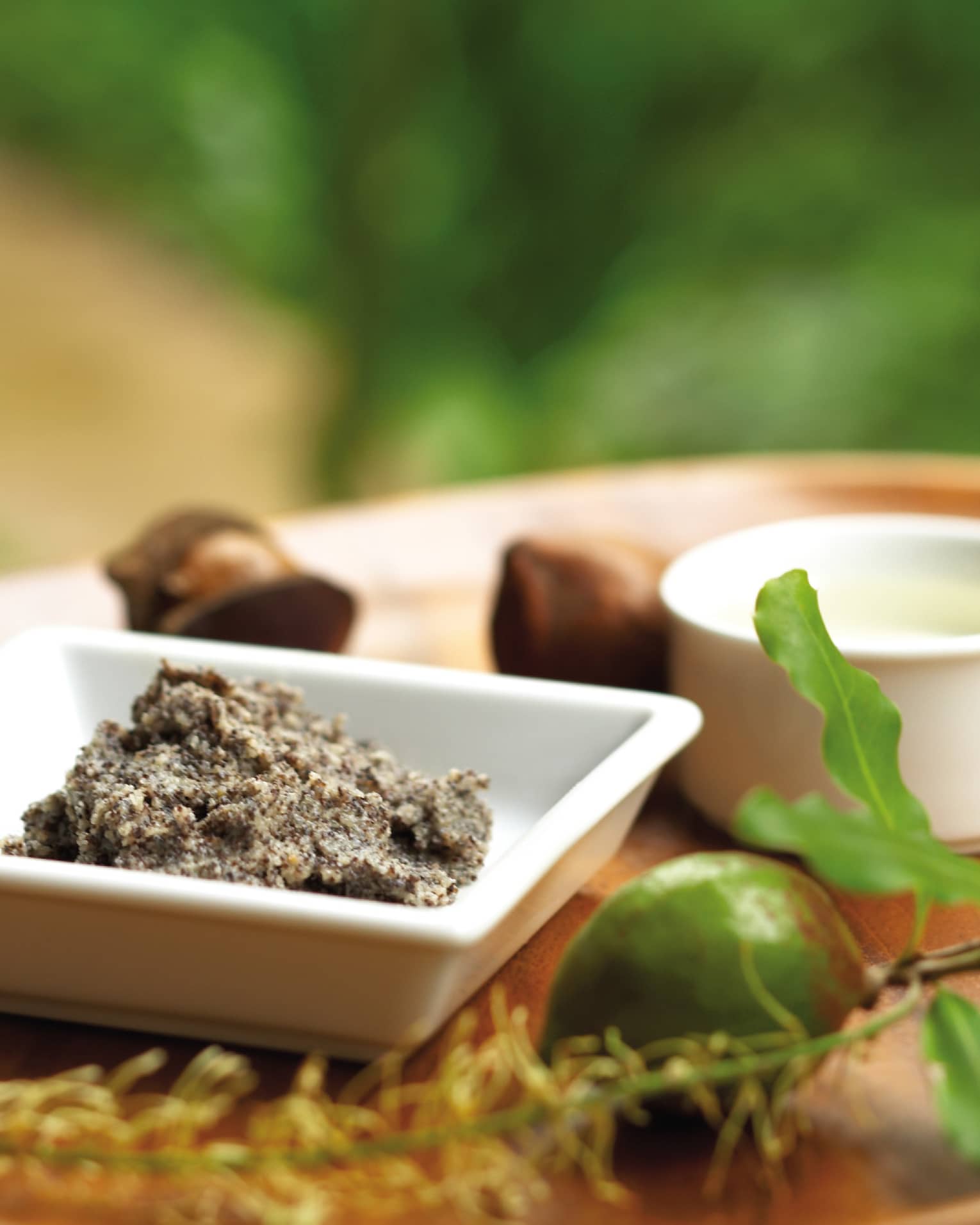 Ground nut butter, whole lime, small dishes on spa tray