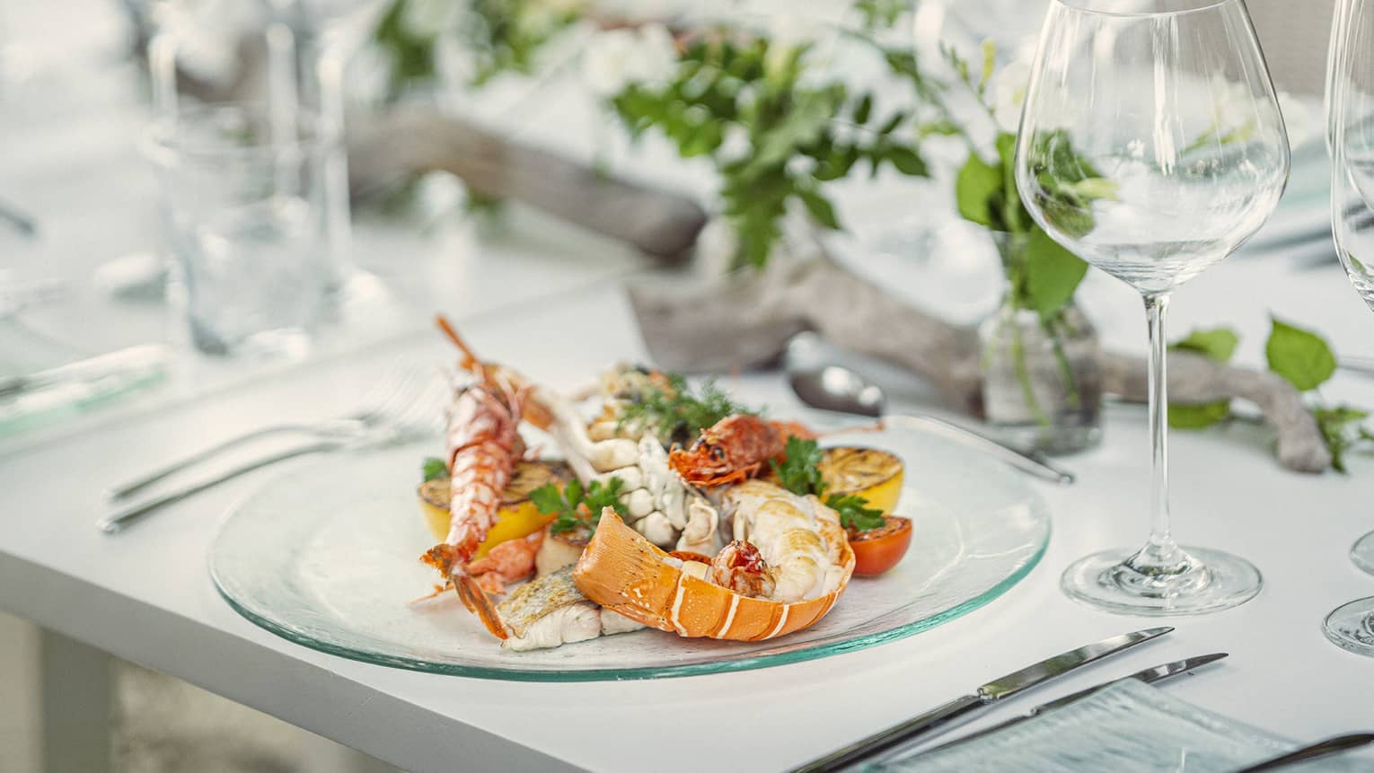 Dining table set, with seafood dish plated