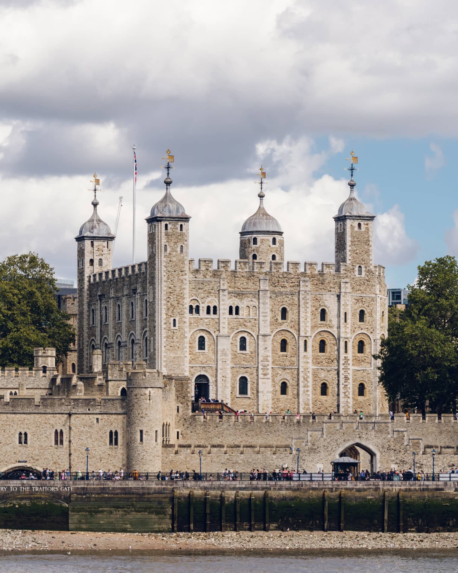Tower of London under sky dappled with clouds