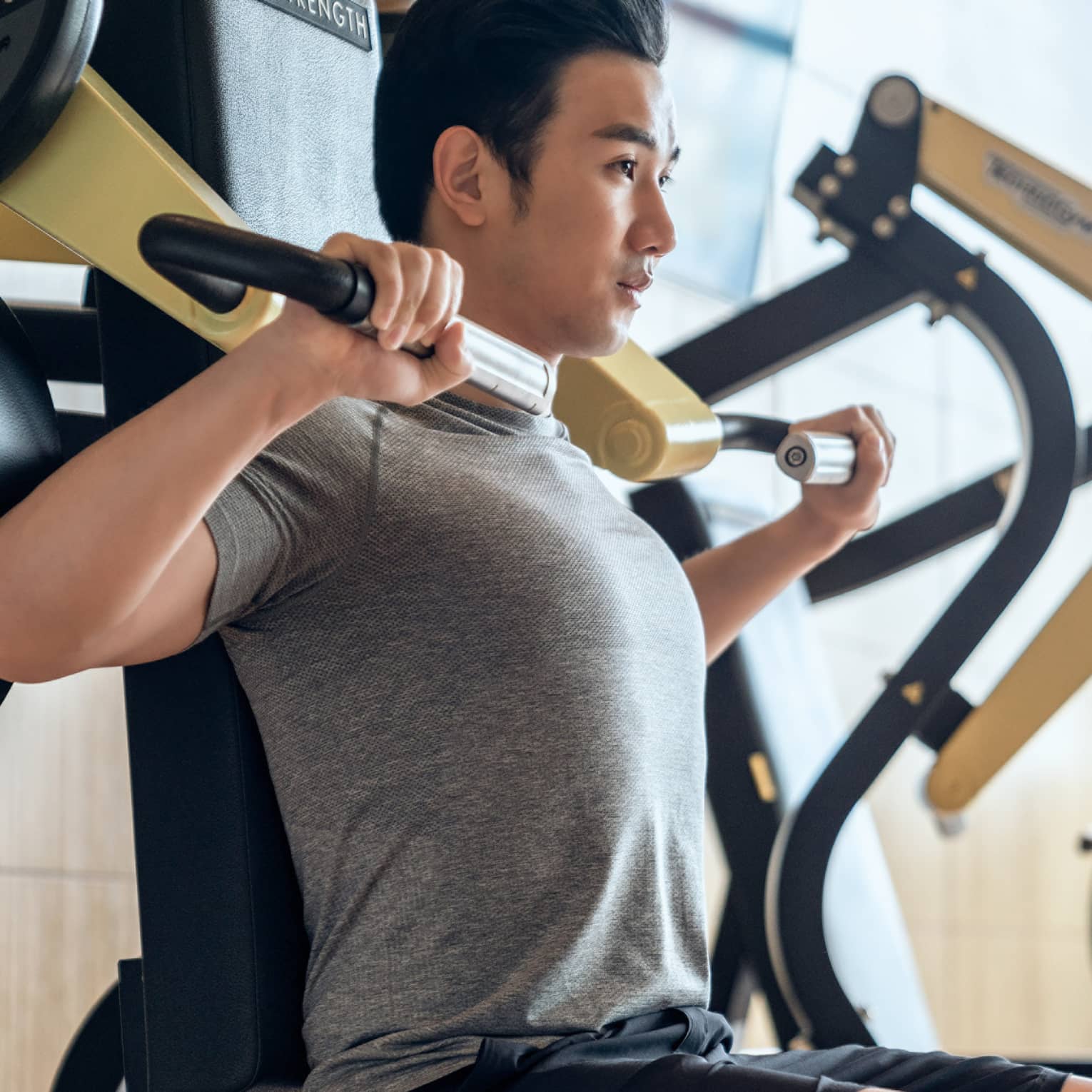Guest using fitness equipment in gym at Four Seasons