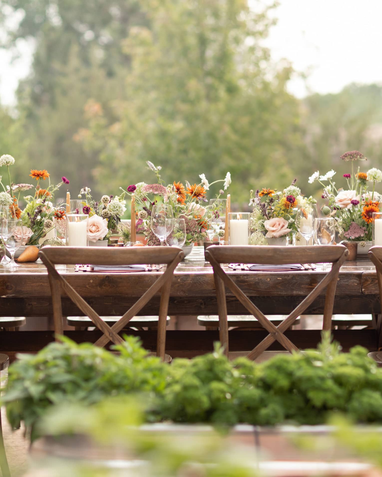 A table outside covered in flowers.