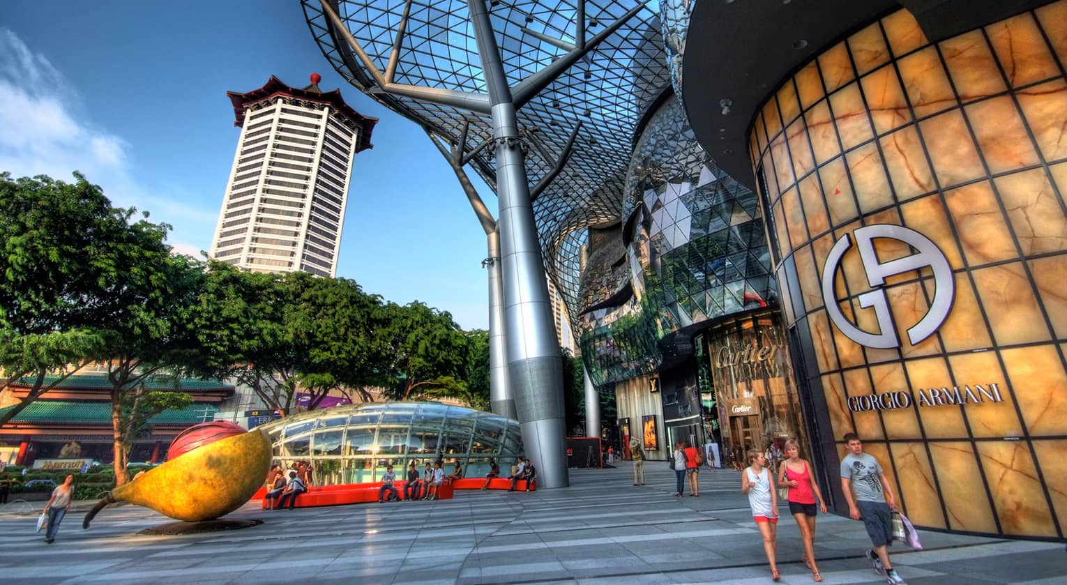 ,People walking outside of a modern shopping mall