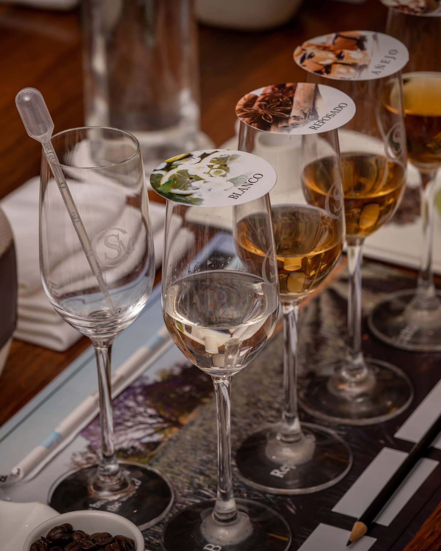 Blending tequila in glasses with covers.