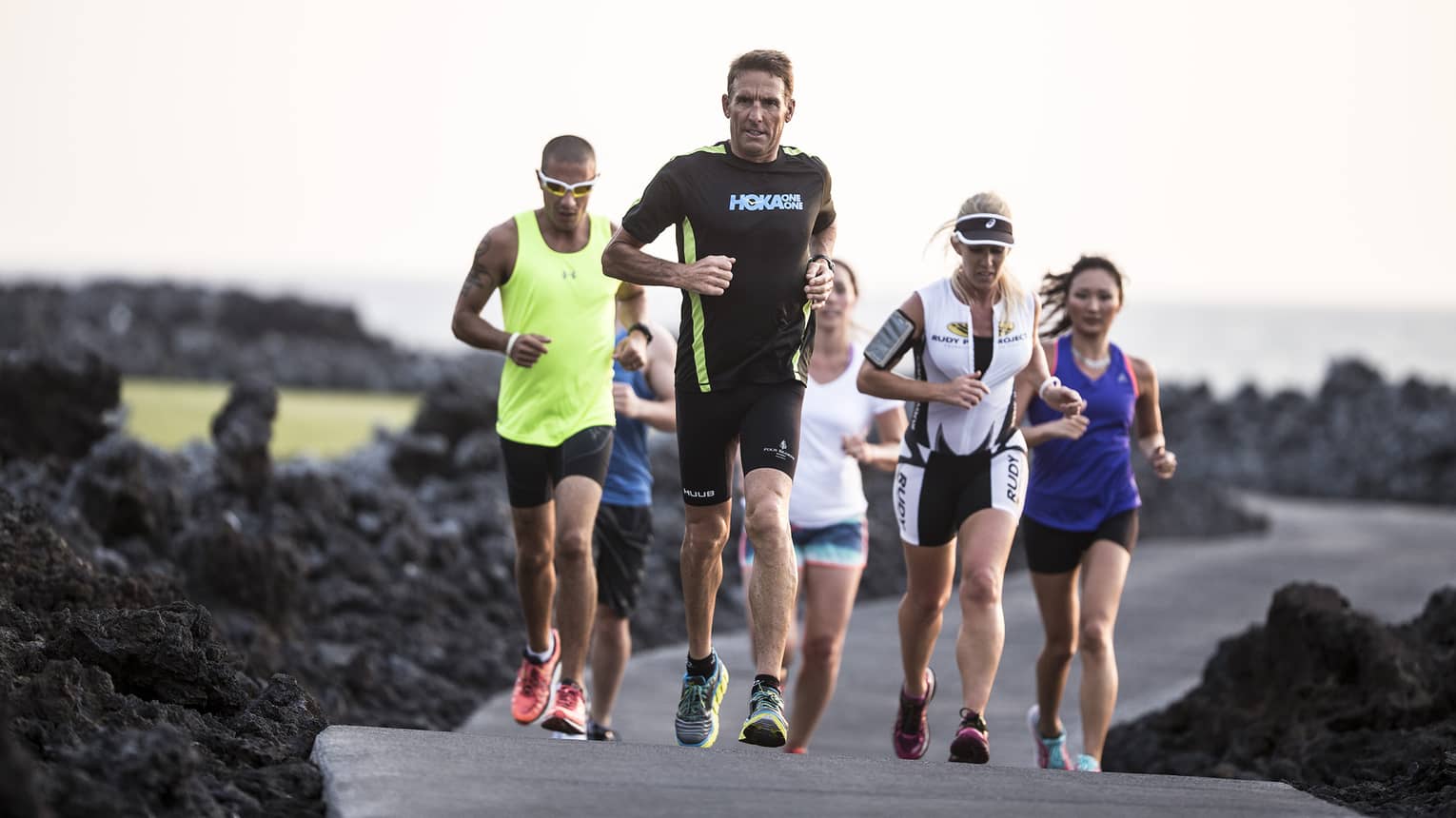 Guests running past volcanic ash with Dave Scott for his specialty triathlon training